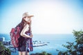 Hiker with backpack relaxing on top of a mountain Royalty Free Stock Photo