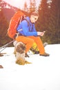 Hiker with backpack resting during a hike.