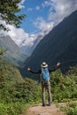 Hiker with backpack standing on the rock enjoy mountain view Annapurna ,Nepal.