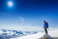 Hiker with backpack standing on top and enjoying tne view Royalty Free Stock Photo