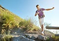 Hiker with backpack trekking on a mountain trail Royalty Free Stock Photo