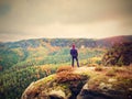 Hiker backpacker reaches the summit of mountain peak. Success, freedom and happiness Royalty Free Stock Photo