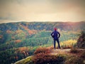 Hiker backpacker reaches the summit of mountain peak. Success, freedom and happiness Royalty Free Stock Photo