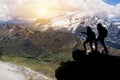 Hiker with backpacks reaches the summit of mountain peak. Success, freedom and happiness, Achievement in mountains. Active sport Royalty Free Stock Photo