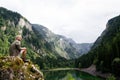 Hiker with backpacks reaches the summit of mountain peak. Success, freedom and happiness concept Royalty Free Stock Photo