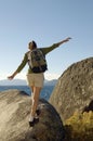 Hiker Balancing On Boulder At Coast Royalty Free Stock Photo