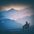 Hiker and blue morning fog. Instagram stylisation Royalty Free Stock Photo