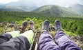 Hiker boots and legs resting on the mountain peak Royalty Free Stock Photo