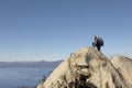 Hiker On Boulder At Coast Royalty Free Stock Photo
