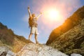 Hiker celebrating summer hike outdoors