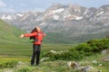 Hiker celebrating vacation in a high mountain