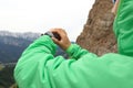 Hiker checking the altimeter on sports watch at mountain peak Royalty Free Stock Photo