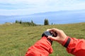 Hiker checking the altimeter on sports watch at mountain peak Royalty Free Stock Photo