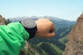 Hiker checking the altimeter on sports watch at mountain peak Royalty Free Stock Photo