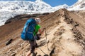 Hiker is climbig to Manaslu base camp in highlands of Himalayas