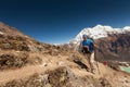 Hiker is climbig to Manaslu base camp in highlands of Himalayas Royalty Free Stock Photo