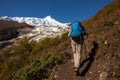 Hiker is climbig to Manaslu base camp in highlands of Himalayas