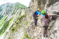 Hiker climbing in the mountain of Alps, Europe