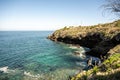 Hiker Climbs Up From Water Level in Pelican Harbor Royalty Free Stock Photo