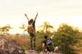 Hiker couple backpack pointing and sitting happy feeling freedom good and strong Royalty Free Stock Photo