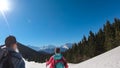 Dreilaendereck - Hiker couple walking on snow covered meadow at Dreilaendereck, Karawanks, Carinthia, Austria