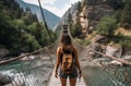 Hiker crossing river on bridge Royalty Free Stock Photo