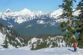 Hiker descending snow slope during winter in North Cascades, Washington Royalty Free Stock Photo