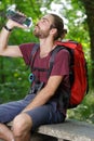 hiker drinking water while resting Royalty Free Stock Photo
