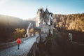 Hiker at Eltz Castle at sunrise, Rheinland-Pfalz, Germany