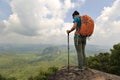 Hiker enjoy the view hiking on mountain peak