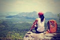 Hiker enjoy the view on mountain top cliff Royalty Free Stock Photo