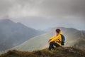 Hiker enjoying achievement after climbing mountain Royalty Free Stock Photo