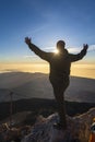 Hiker enjoying sunrise from top of the El Teide volcano