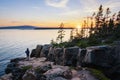 A hiker enjoying the sunset at Schoodic Point Maine Royalty Free Stock Photo