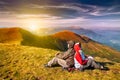 Hiker enjoying valley view from top of a mountain