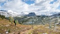 Hiker enjoying view on beautiful alpine valley with fresh snow, Mt Assiniboine Pr Park, Canada Royalty Free Stock Photo