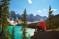 Hiker enjoying the view of Moraine lake in Banff National Park Royalty Free Stock Photo