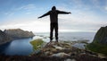 Hiker enjoying the view over Reinefjorden, Lofoten, Norway Royalty Free Stock Photo