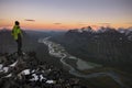 Hiker enjoying the view of a river shapen valley, Rapadalen, Sweden