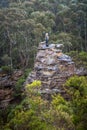Hiker exhilaration after climbing a pagoda in mountains