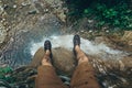 Hiker Explorer Sitting On Cliff With Waterfall View. Travel Lifestyle Adventure Vacations Concept