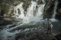Hiker Exploring River Gorge and the Scenic Waterfalls