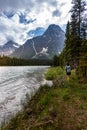 Hiker admires Mt Chephren and Waterfowl Lakes near Hwy 93 Icefield Parkway Canadian Rockies Royalty Free Stock Photo