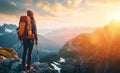 Hiker facing a stunning alpine sunrise with a backpack, standing on a mountain ridge.