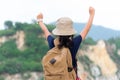 Hiker girl children happy feeling freedom good and strong weight victorious facing on the natural mountain