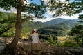 Hiker girl looking on Domasin meander of river Vah in Slovakia