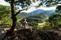 Hiker girl looking on Domasin meander of river Vah in Slovakia