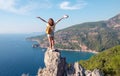 Hiker girl on the mountain top, concept of freedom, victory, active lifestyle, Kabak beach, Oludeniz, Turkey Royalty Free Stock Photo