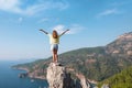 Hiker girl on the mountain top, concept of freedom, victory, active lifestyle, Kabak beach, Oludeniz, Turkey Royalty Free Stock Photo