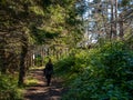 Hiker girl`s walking on a trail in the beautiful Forillon Natinal Park , Gaspesie, Quebec, Canada